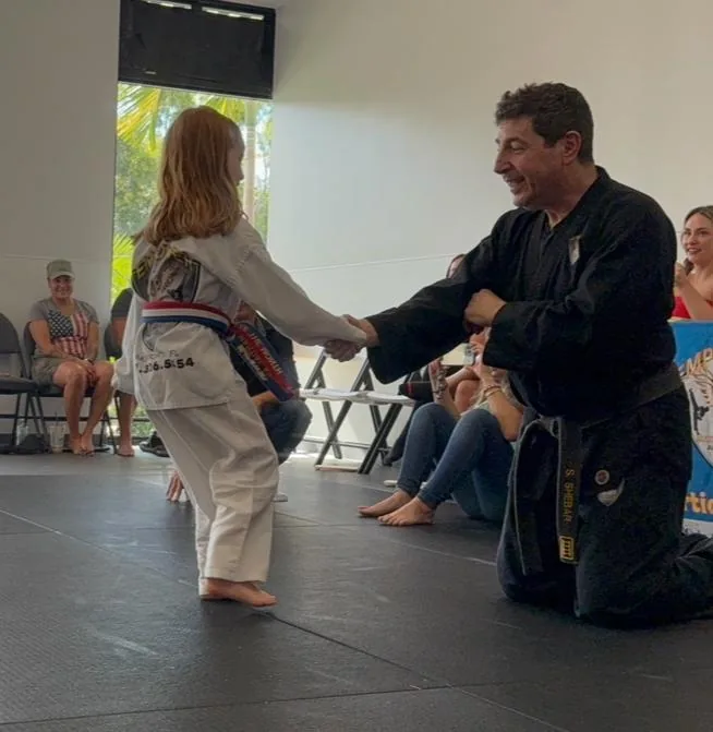 Young student ready for board break at Empower Martial Arts