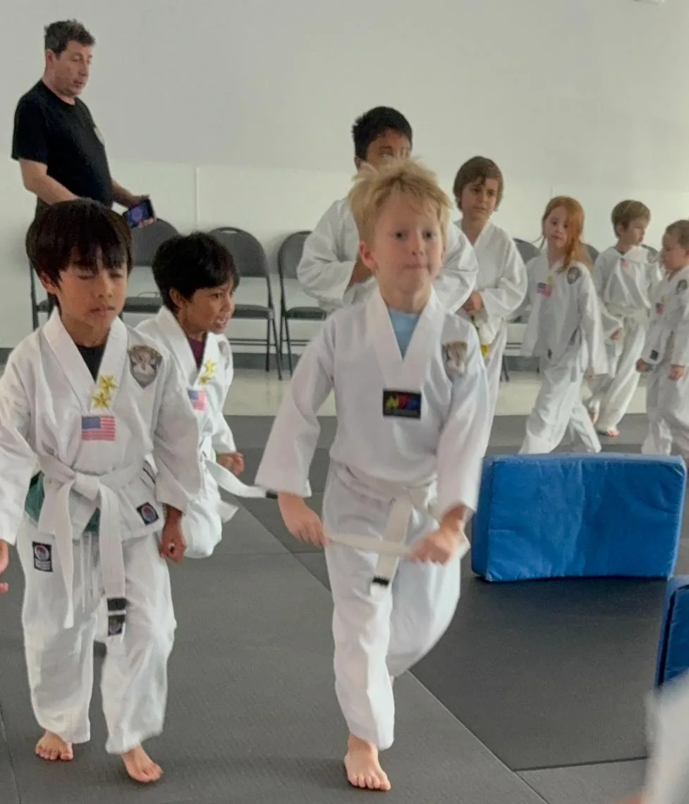 Little Ninjas walking onto the mat at Empower Martial Arts