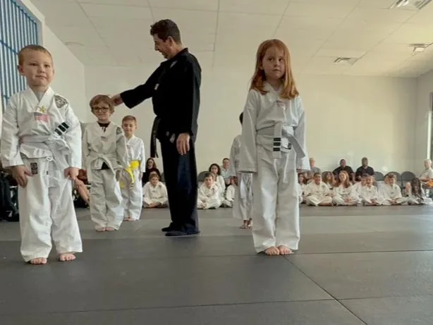 Instructor coaching Little Ninjas during belt testing