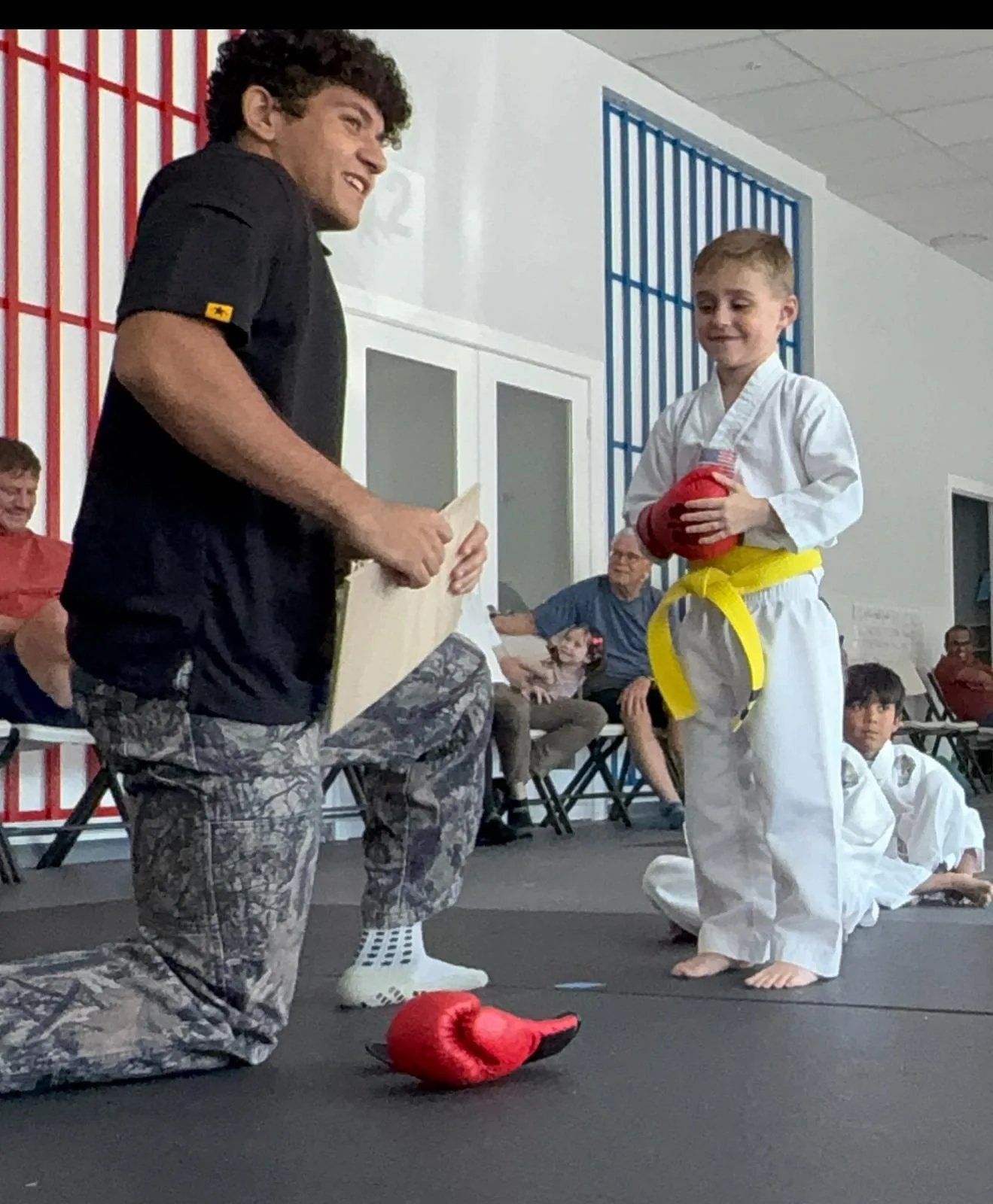 Kids martial arts class practicing forms at Empower Martial Arts