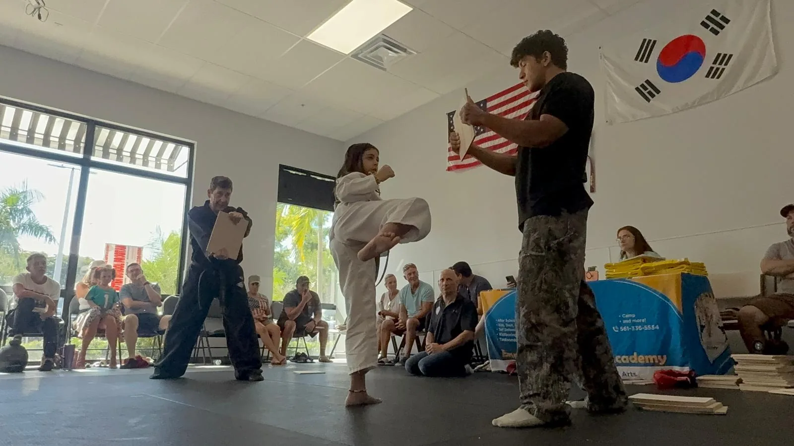 Taekwondo student performing side kick at Empower Martial Arts