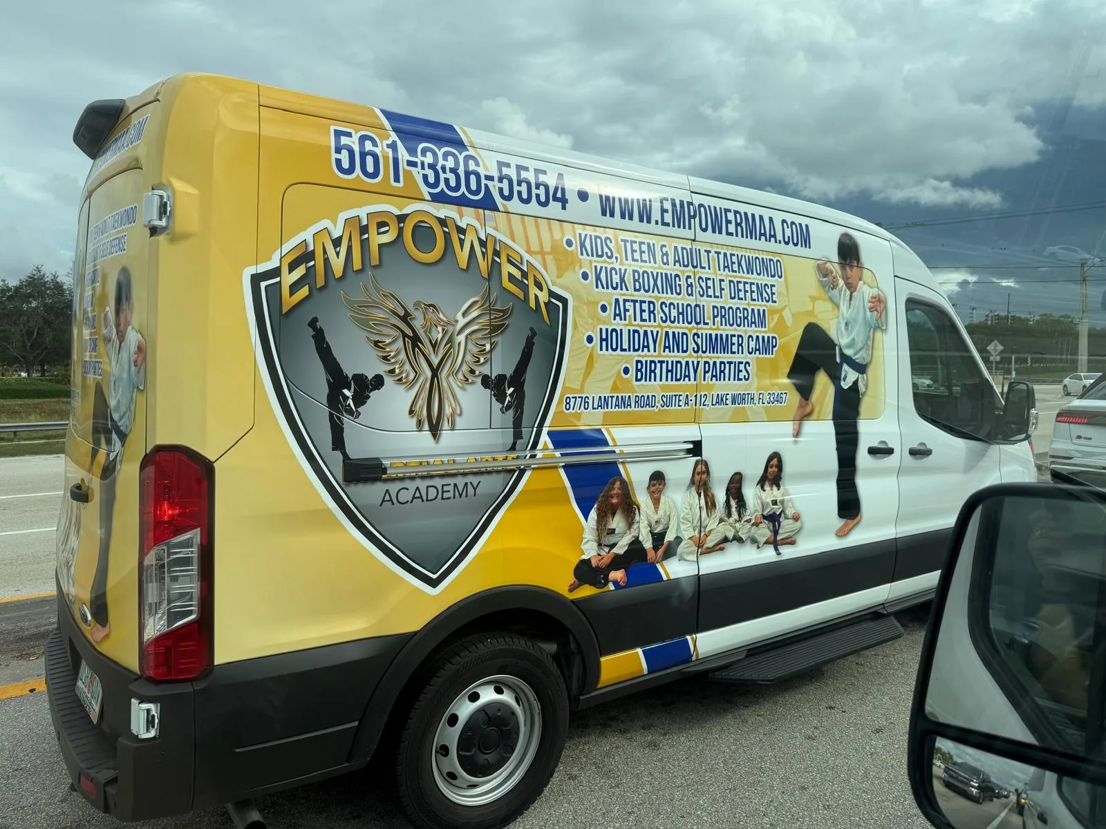Empower Martial Arts branded after school pickup van